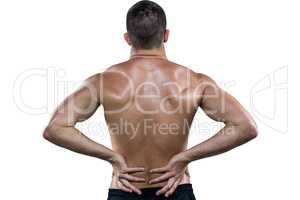 Rear view of shirtless athlete with back pain