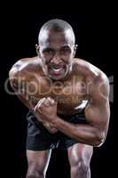 Portrait of muscular man flexing muscles
