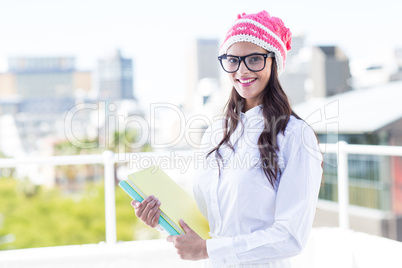 Pretty woman holding documents