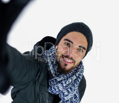 Bearded man using a selfie stick