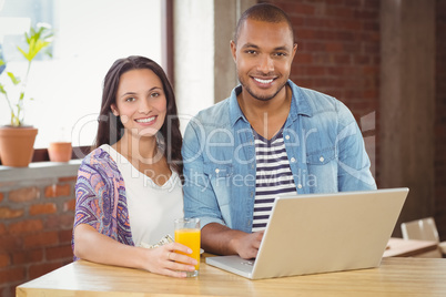 Portrait of smiling business people working in office