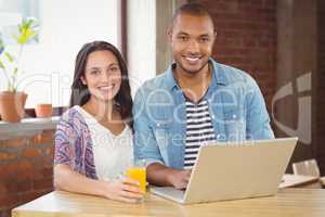 Portrait of smiling business people working in office