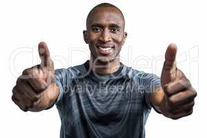 Portrait of confident athlete smiling and showing thumbs up