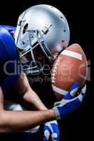 Close-up of upset American football player with ball