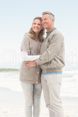 Smiling couple holding one another