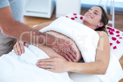 Pregnant woman receiving massage