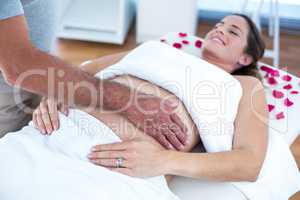 Pregnant woman receiving massage