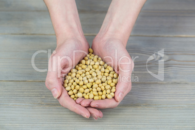 Woman showing handful of chickpeas Woman showing handful of chickpeas