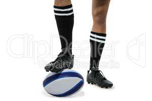 Rugby player in black socks on ball