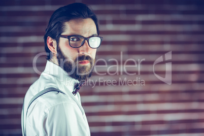 Portrait of confident hipster wearing eyeglasses