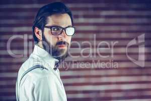 Portrait of confident hipster wearing eyeglasses