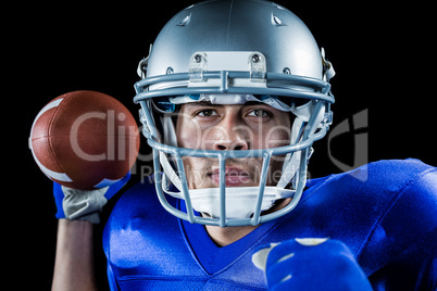 Close-up portrait of sportsman holding ball