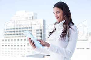 Smiling woman using tablet pc