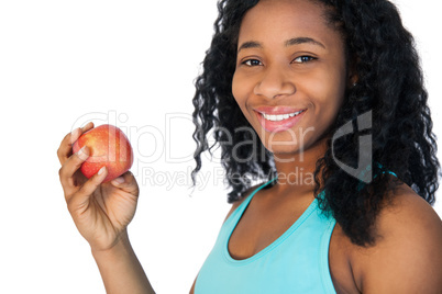 Model holding a red apple