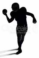 American football player throwing ball