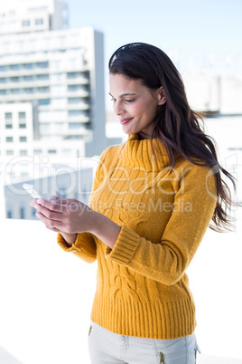 Pretty woman using her smartphone