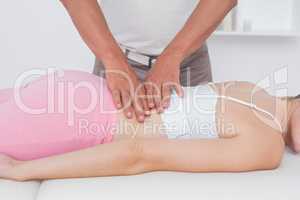 Physiotherapist doing back massage