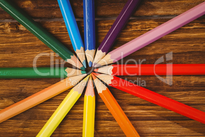 Colour pencils on desk in circle shape