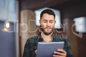 Man using digital tablet in office