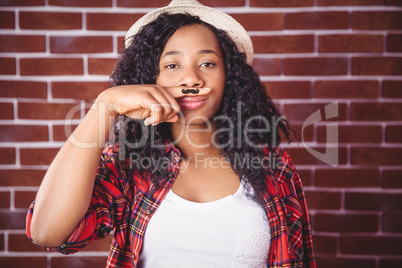 Hipster with mustache on finger