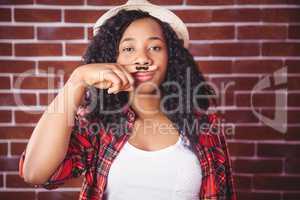 Hipster with mustache on finger