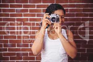 Young woman taking a photo