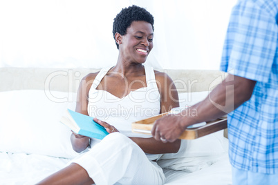 Woman holding book and looking