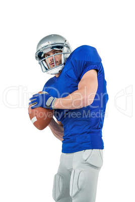 American football player throwing ball