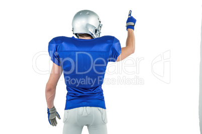 Rear view of American football player pointing