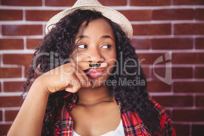 Hipster with mustache on finger