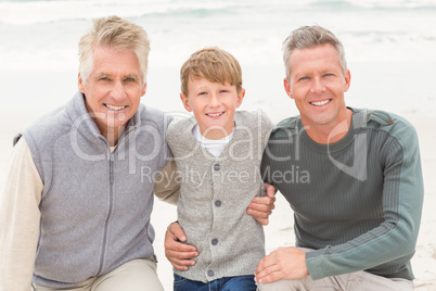 Young boy with his father and grandfather
