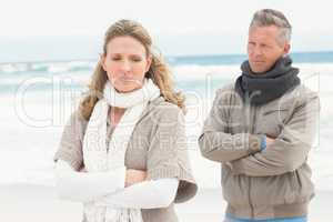 Upset couple look away from each other