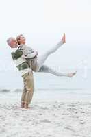 Man lifting his partner into the air