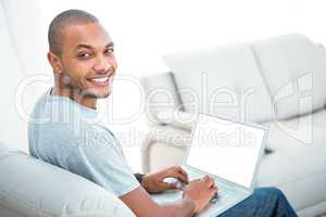 Portrait of happy man with laptop