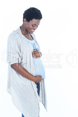 Pregnant woman looking at her belly