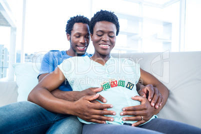 Husband and wife looking at baby cubes