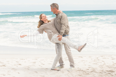 Smiling man holding his partner