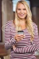 Portrait of woman holding smart phone