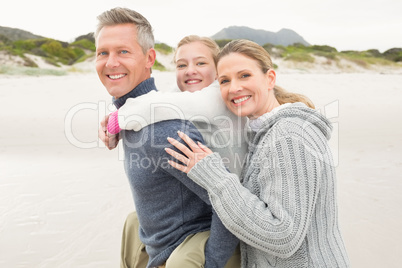 Father carrying his daughter