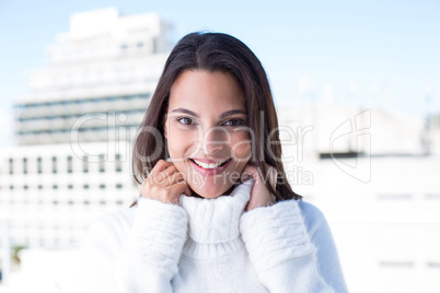 Happy pretty brunette smiling at camera