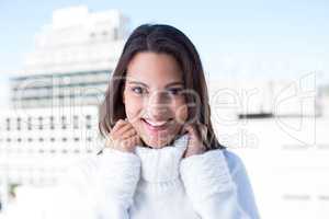 Happy pretty brunette smiling at camera