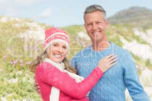 Smiling happy man carrying a woman