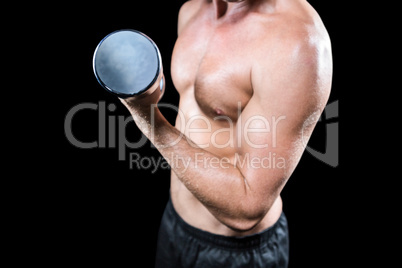 Midsection of shirtless sports player working out with dumbbell
