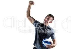 Cheerful rugby player punching the air