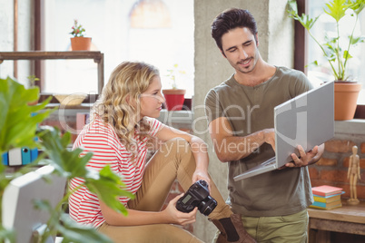 Businessman explaining colleague in office