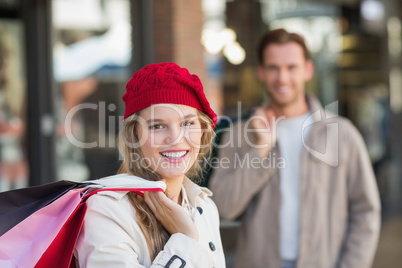 A happy couple with shopping bags