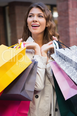 Smiling woman with shopping bags