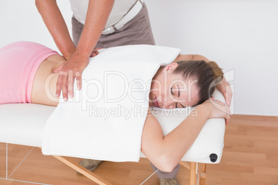 Physiotherapist doing back massage