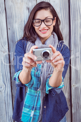 Happy hipster taking a picture