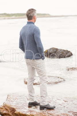 Man standing on a large rock